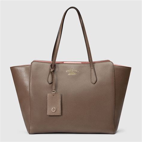 gucci swing tote small vs medium|Why Gucci's Swing Leather Tote Is An Instant Classic.